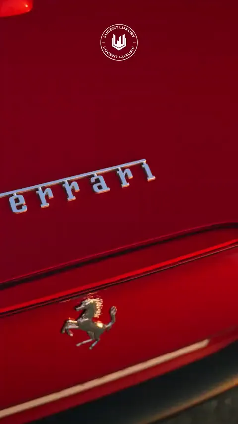 Red sports car flank with chrome lettering