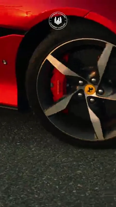 Red sports car wheel and caliper on asphalt