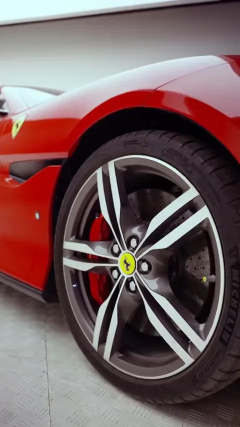 Sports car wheel close-up in a white studio