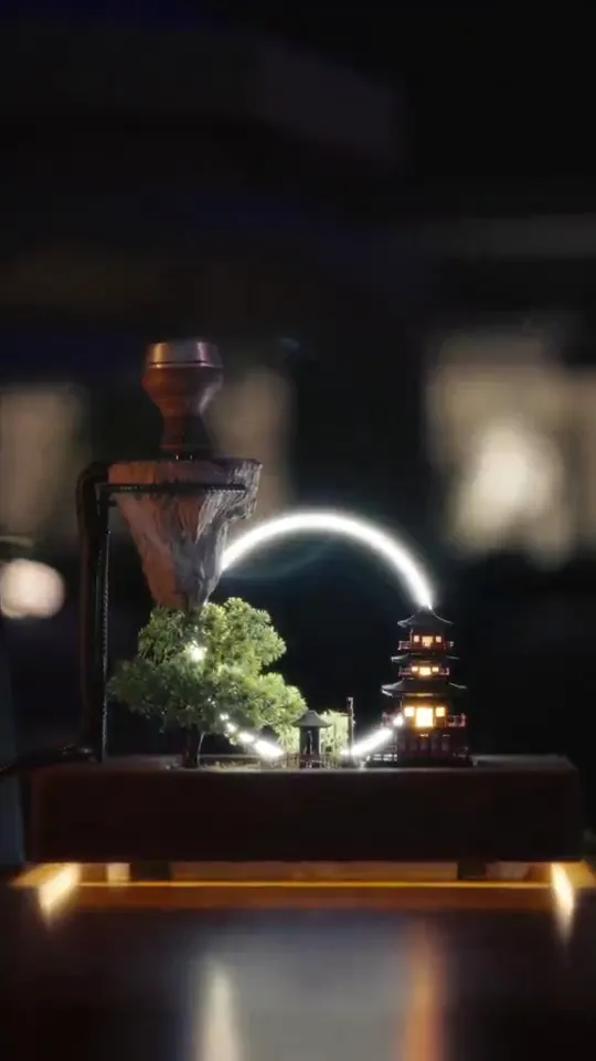 Glowing product display with bonsai and lantern